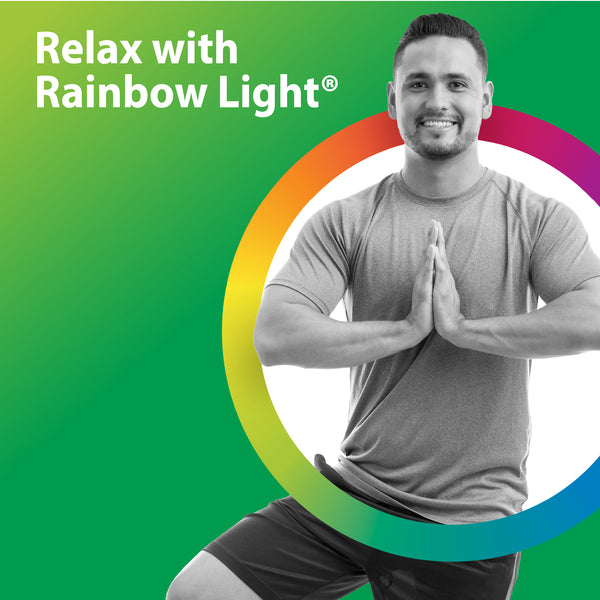 Young adult man in a yoga pose with hands in prayer, next to text 'Relax with Rainbow Light®'.