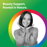 Young adult woman in grayscale, smiling with hands near her face, promoting Pumpkin Seed Saw Palmetto lifestyle.