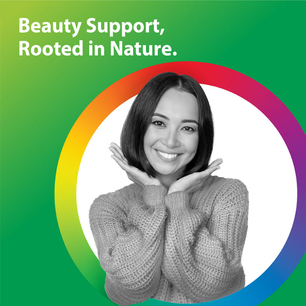 Young adult woman in grayscale, smiling with hands near her face, promoting Pumpkin Seed Saw Palmetto lifestyle.