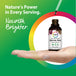 A woman's hand holds a Valerian Root Liquid Extract bottle, with a dropper releasing a drop of liquid above it.