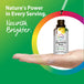 An adult female hand catching liquid drops from a bottle of Dandelion Root Liquid Extract.